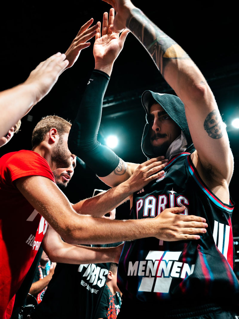 Players high-fiving during the team introductions