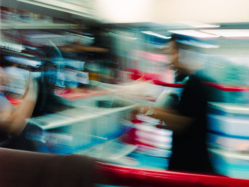 Motion-blurred pan across a boxing gym interior