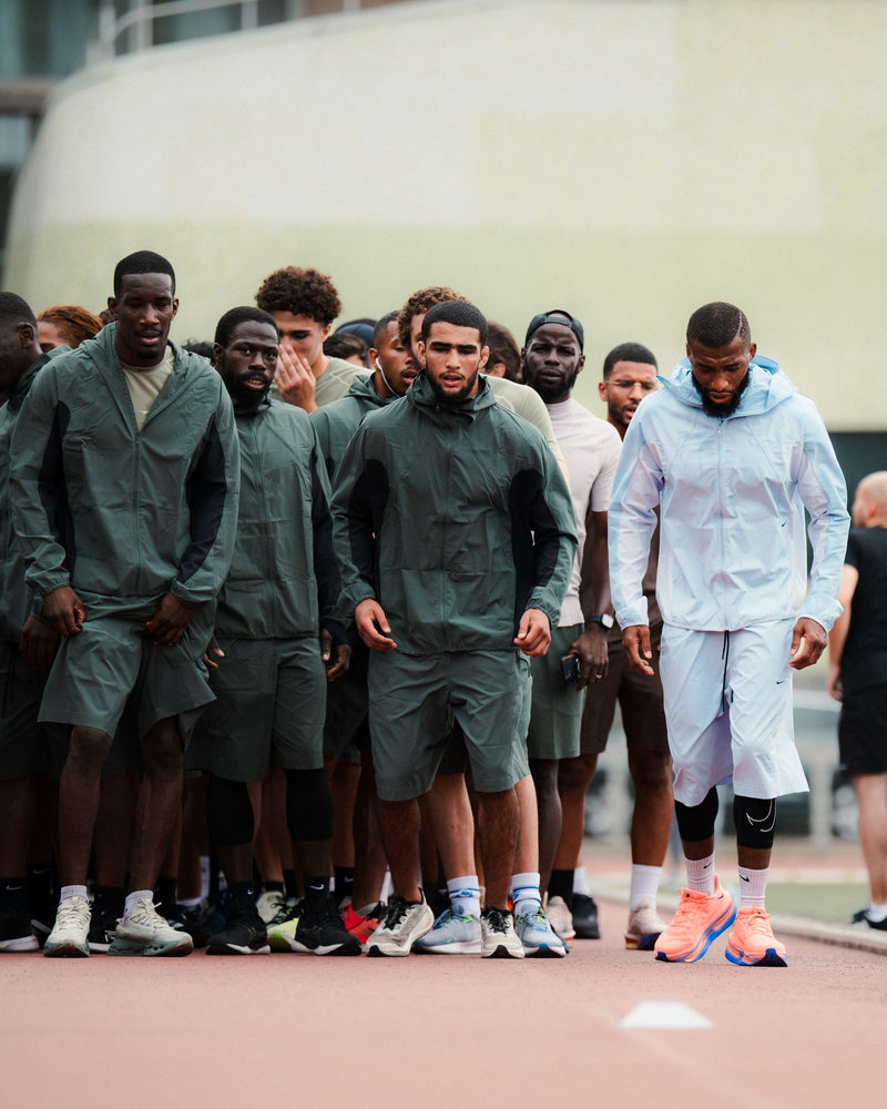 Group of runners walking together on a track