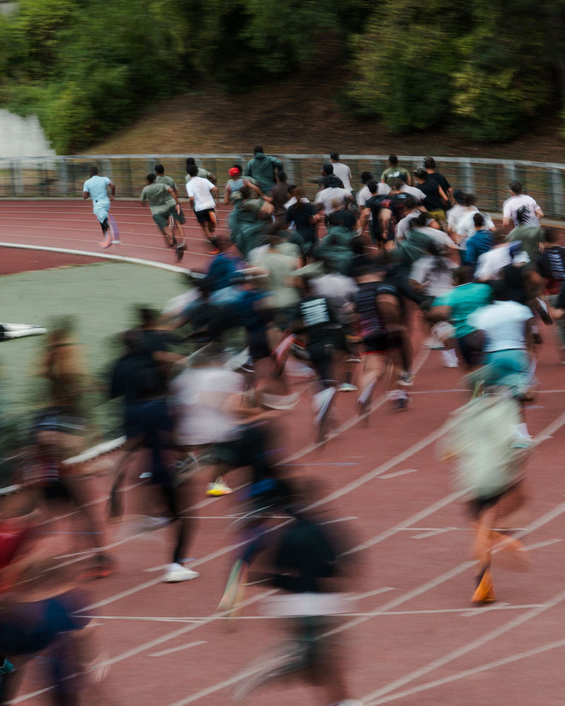 Mass start blurred by a slow shutter on a running track