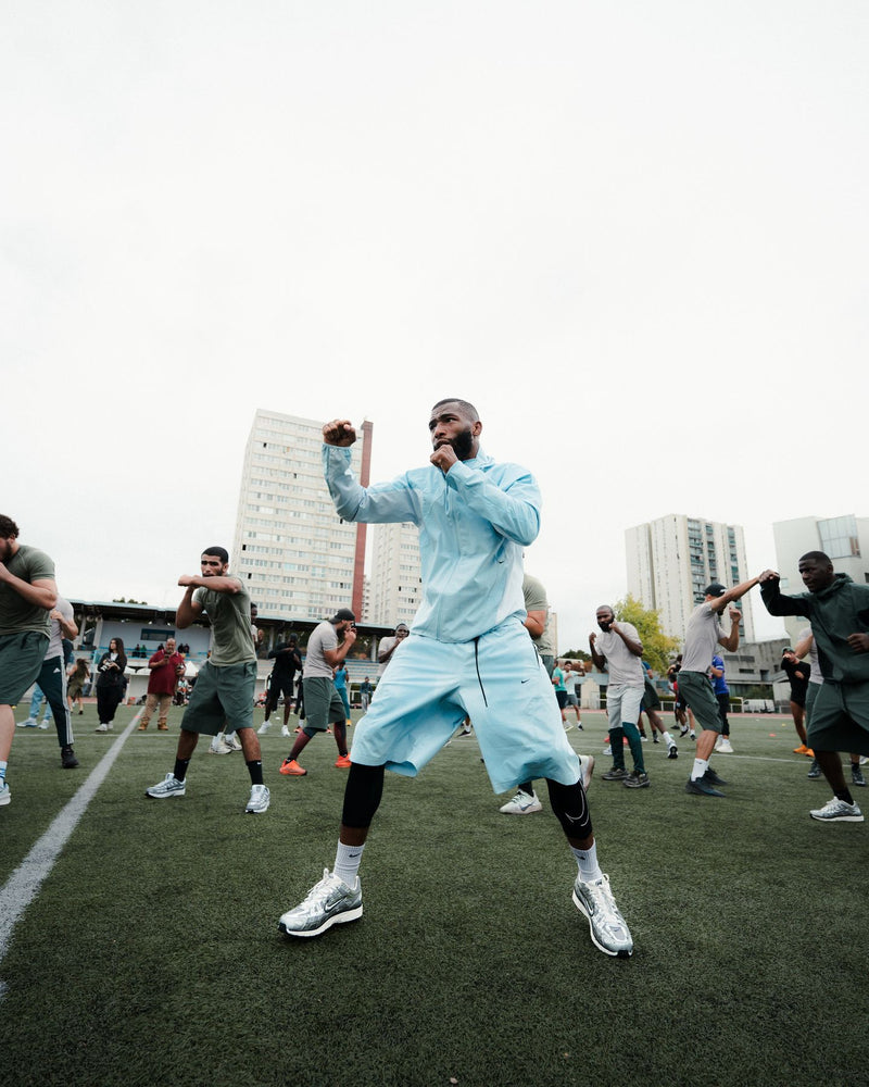 Athlete shadow-boxing during an outdoor warm-up session